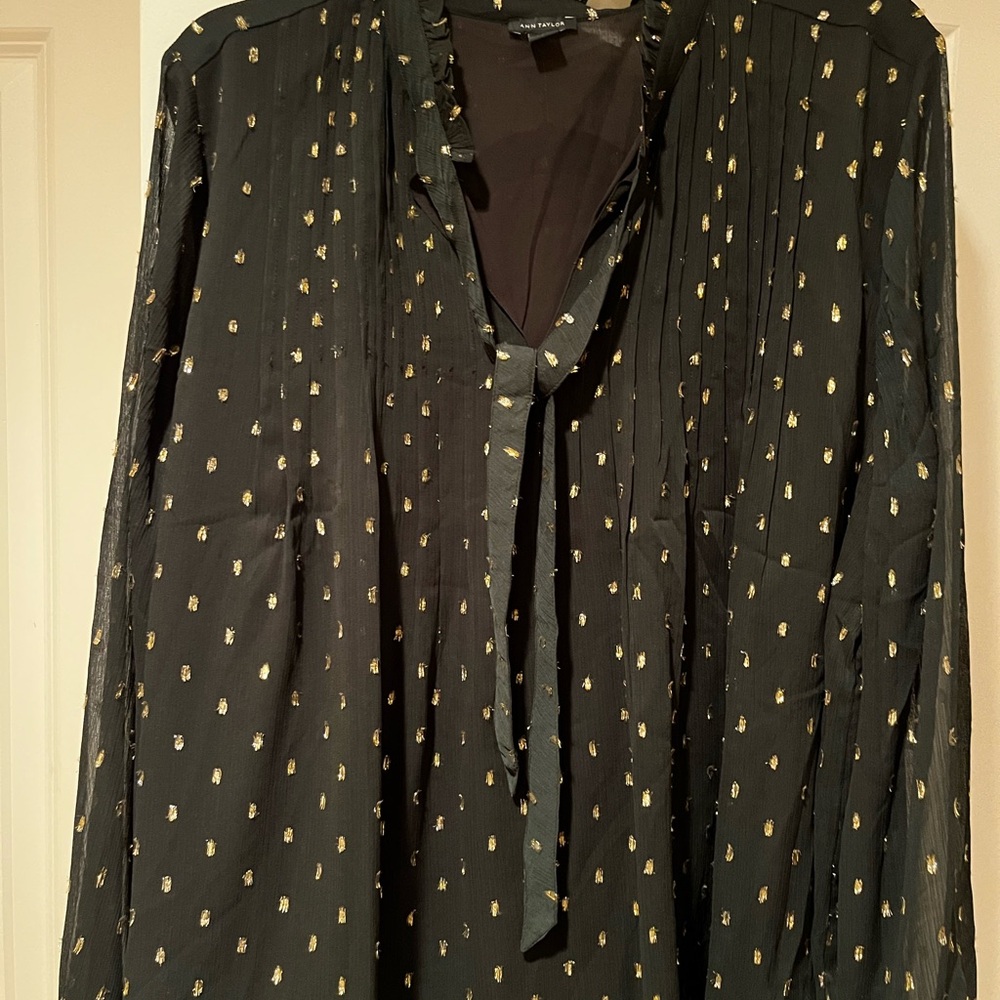Two piece evening set. Blouse and midi skirt with gold metallic dots.